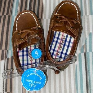 Toddler carters boat shoes. Never worn. Size 4.